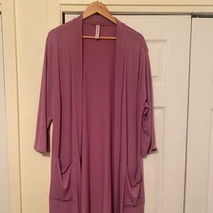 Light purple cardigan.